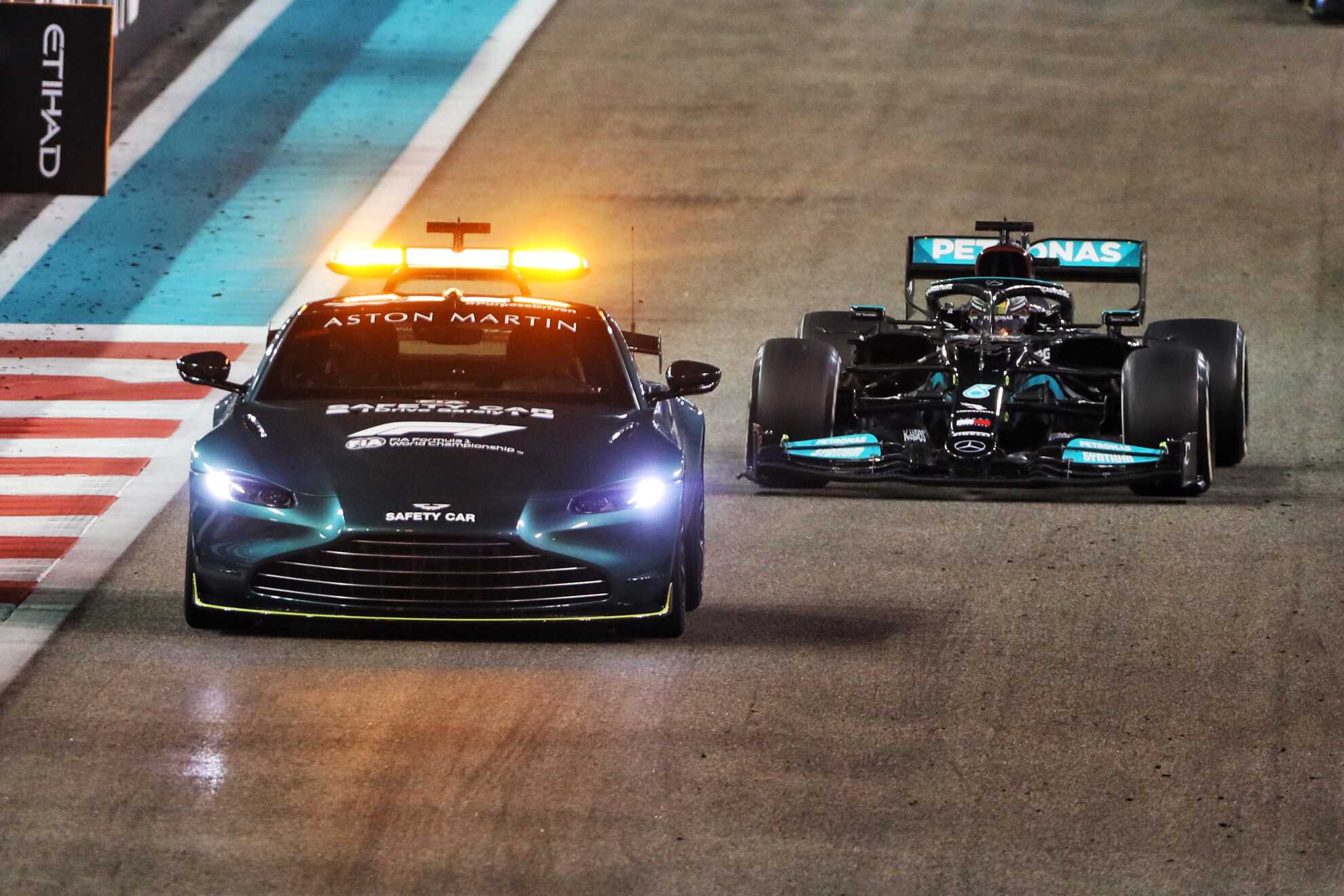 The Aston Martin Vantage safety car leads Lewis Hamilton in the final laps of the 2021 Abu Dhabi Grand Prix
