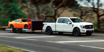 Ford F-150 Platinum towing a Ford Mustang