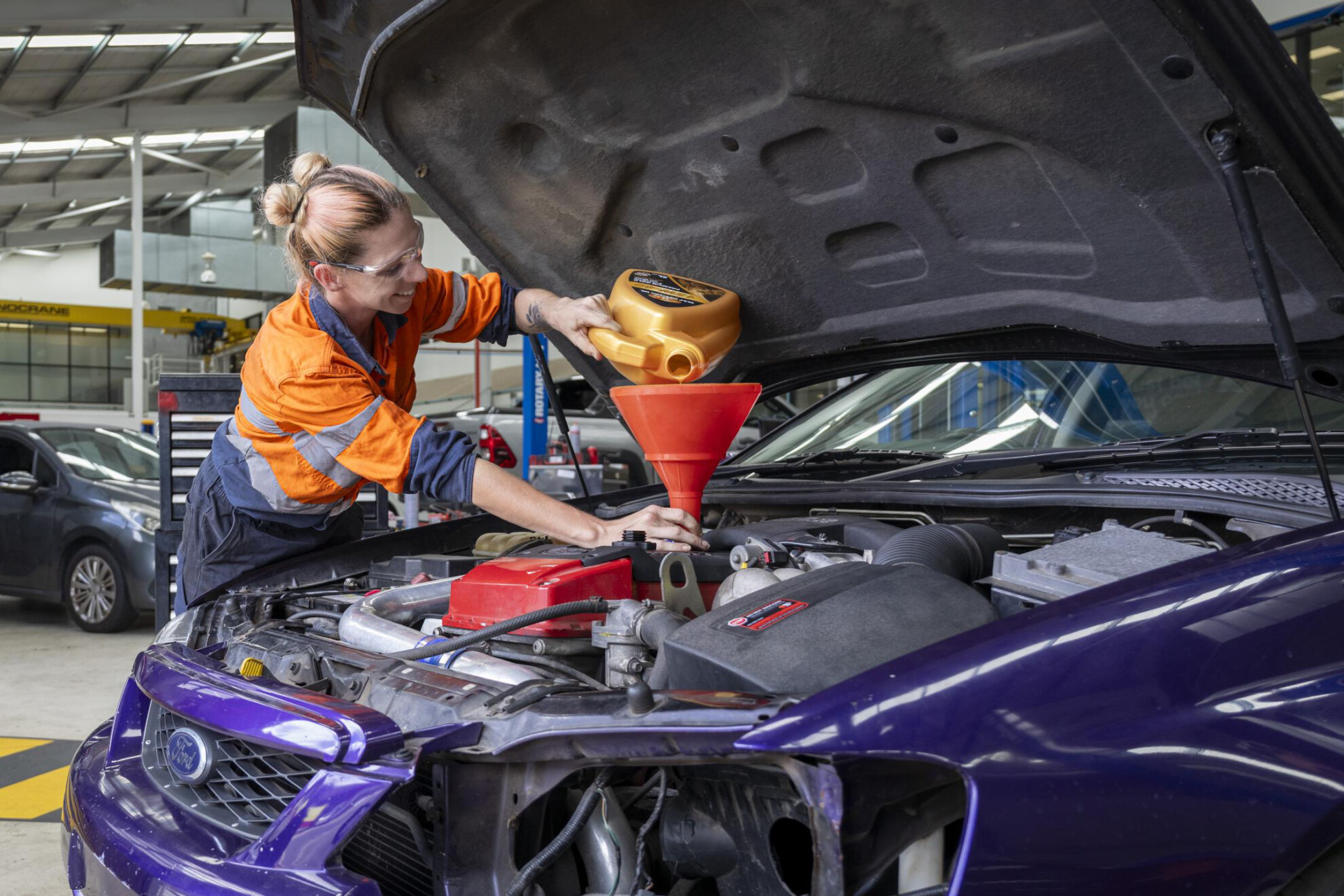TAFE student working on a Ford Falcon seized by Queensland Police