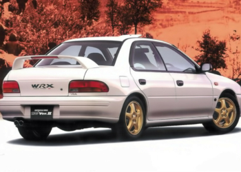 An image of a silver Subaru Impreza WRX in a showroom.